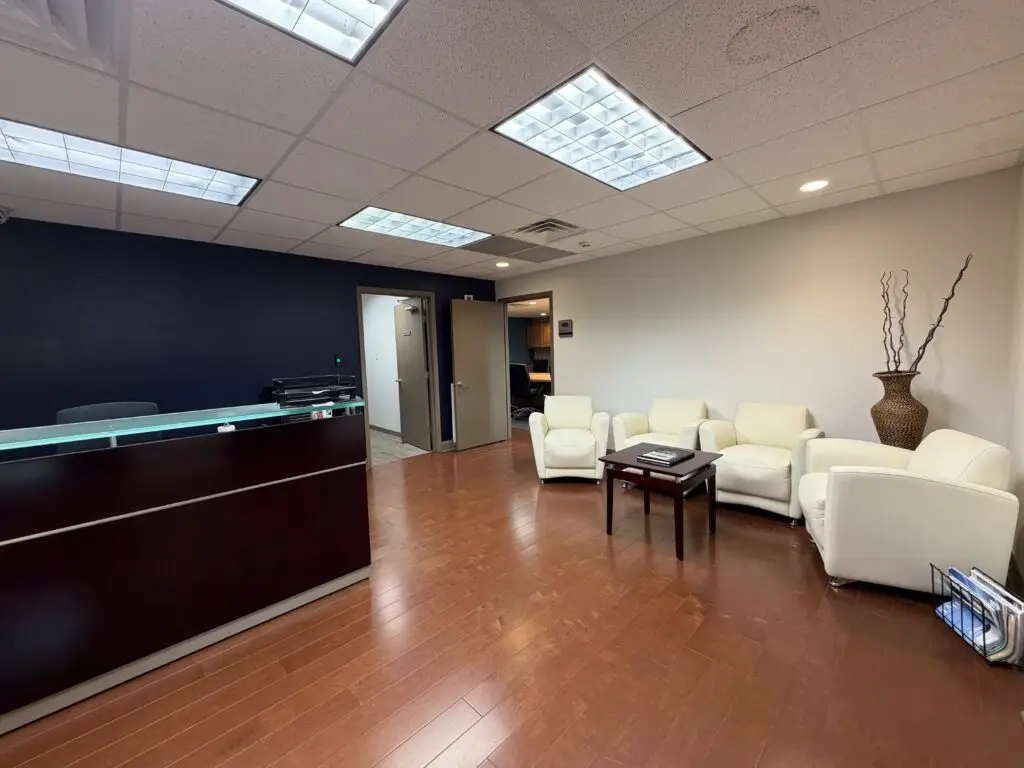 Boardroom Suites reception and waiting area in Metairie with front desk and guest seating