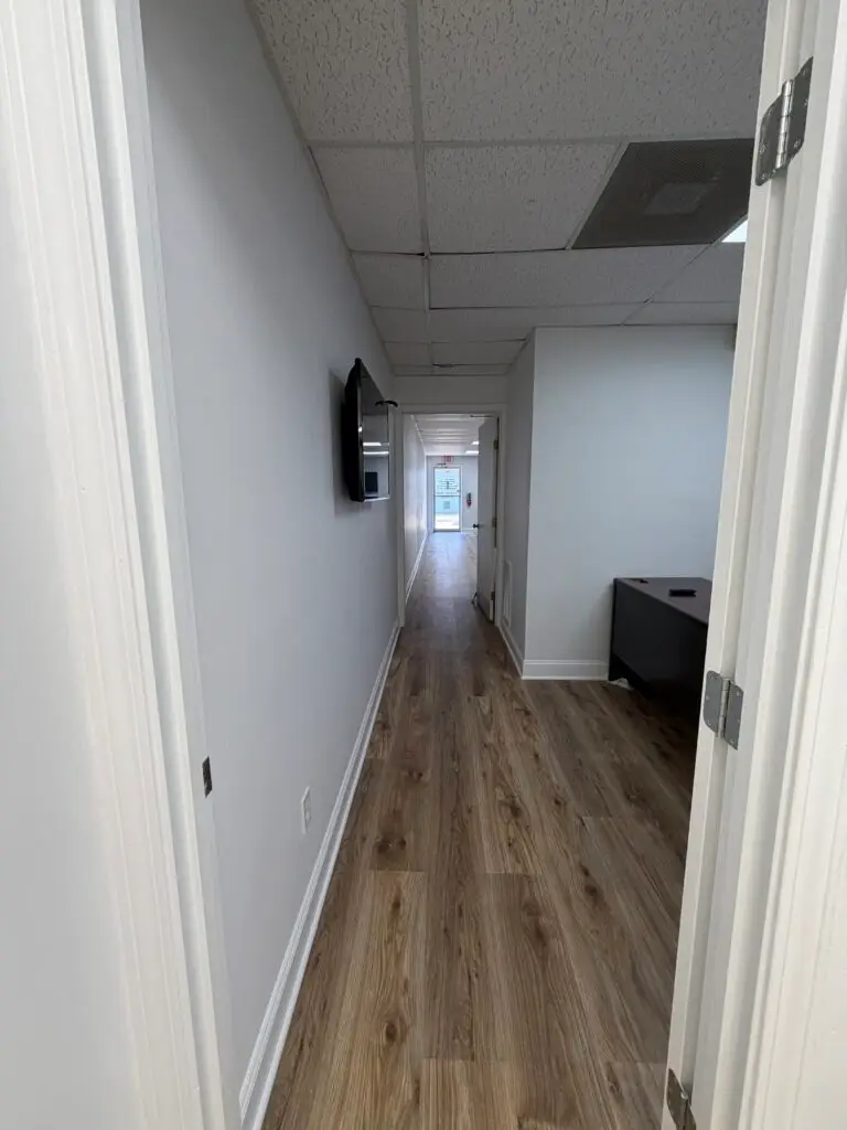 Suite 102 first-floor office in Metairie showing the interior hallway and office access