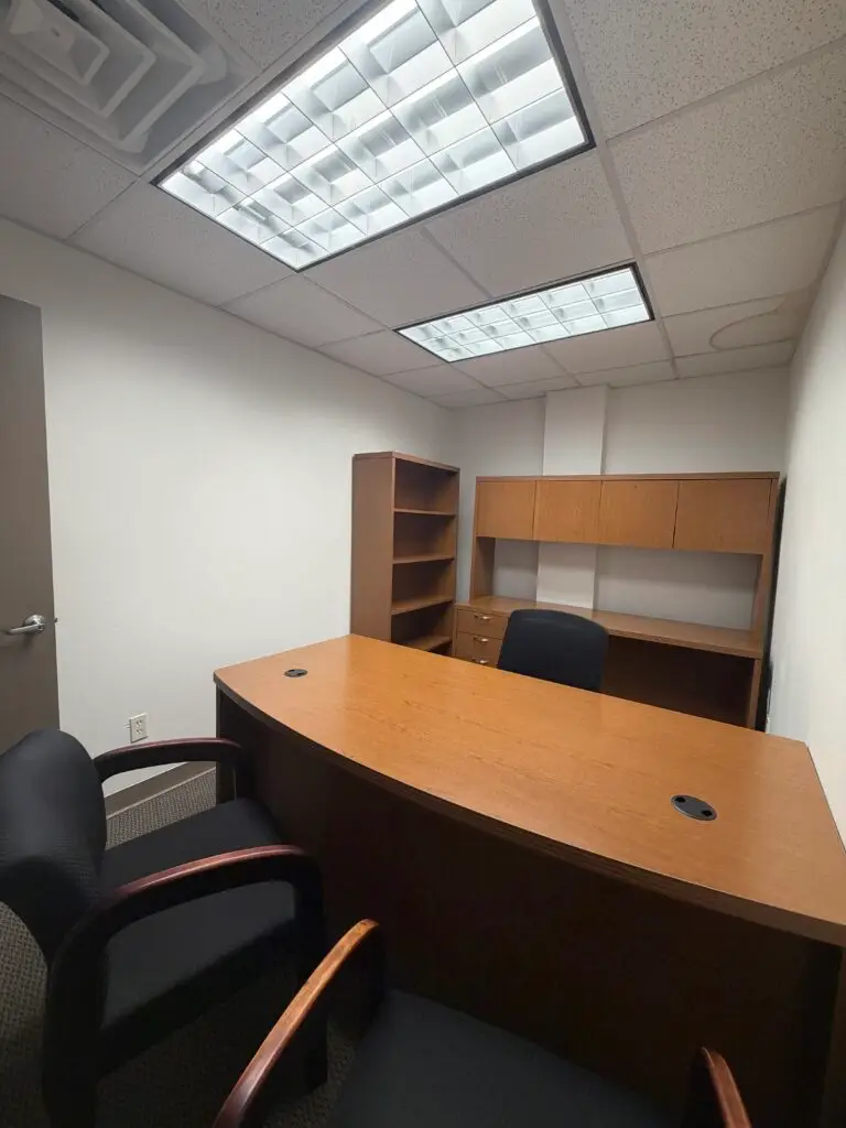 Boardroom Suites Suite 204 furnished private office in Metairie with executive desk and built-in storage