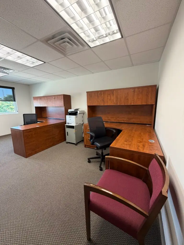 Boardroom Suites Suite 224 private office in Metairie with two furnished workstations and guest seating